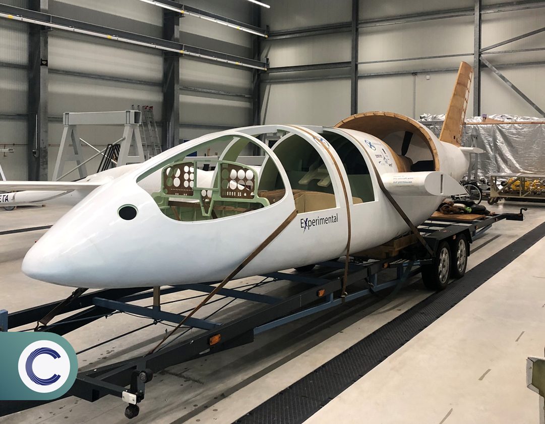 Cormorant fuselage on a trailer inside the hangar